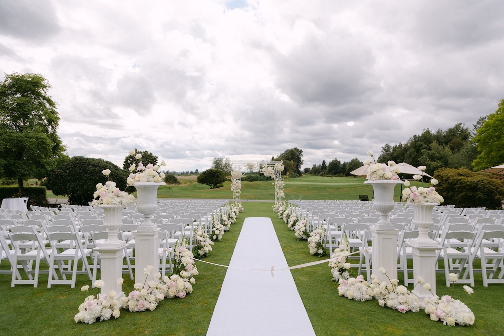 elegant wedding ceremony flowers with arch, aisle and altar arrangements in Vancouver