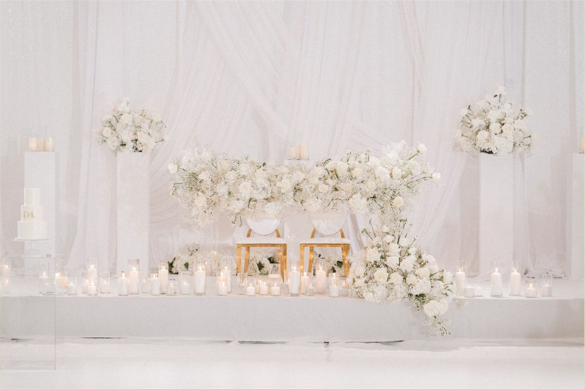 White floral arrangements for wedding head table at Robert-H.-Lee-Alumni-Center