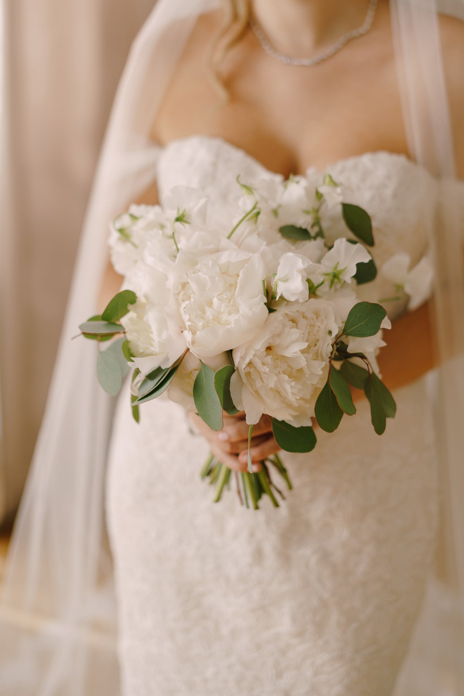 Bride holding a classic bridal flower bouquet