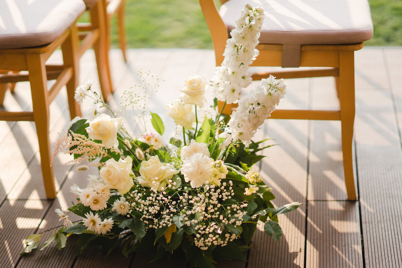 Langley-BC-wedding-ceremony-altar-cream-flower-arrangements