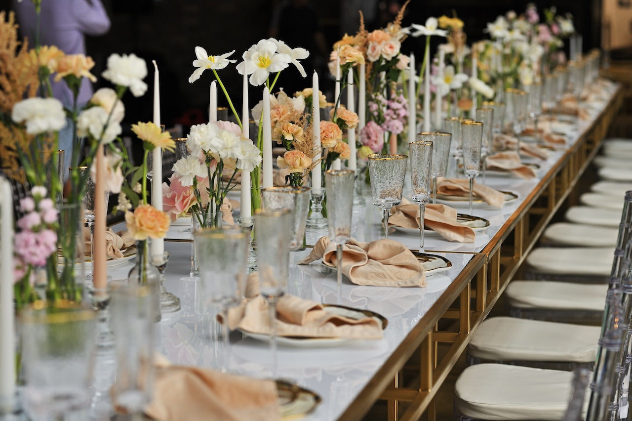 Romantic wedding reception flowers with candles.